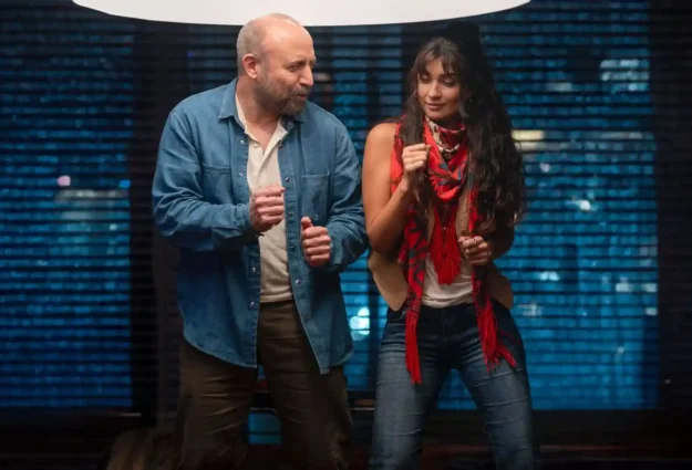 a man and woman standing next to each other